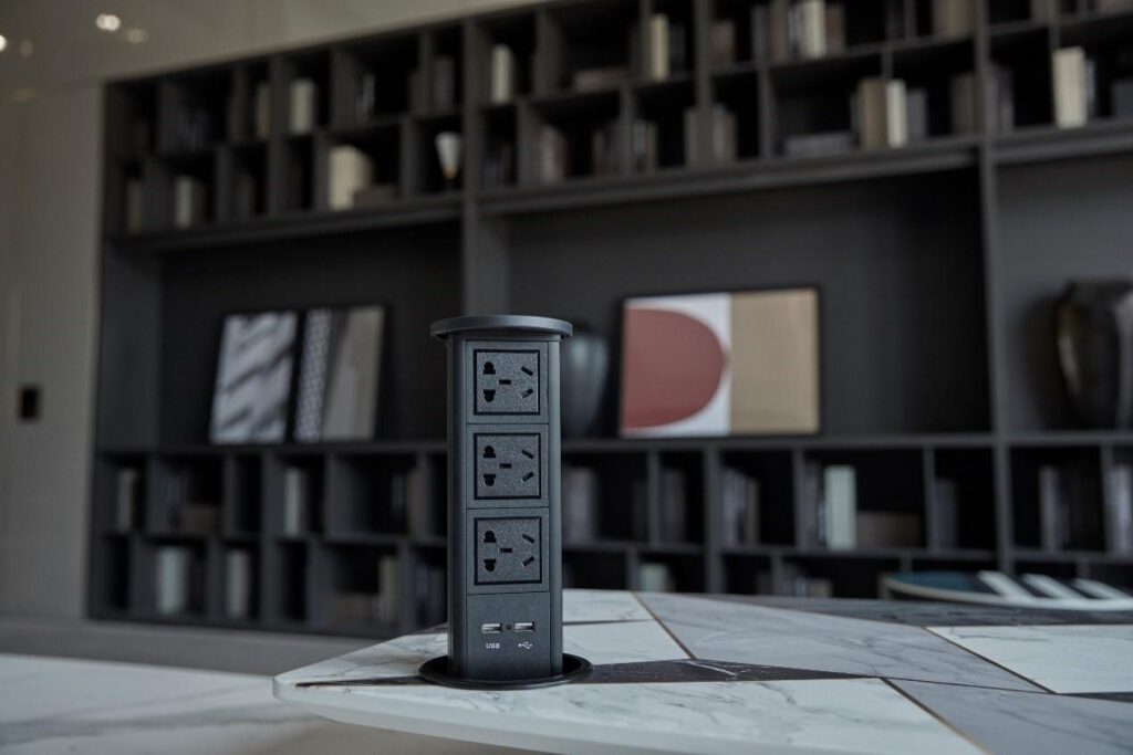 Pneumatic pop-up table outlet with press-activated operation - Moonian