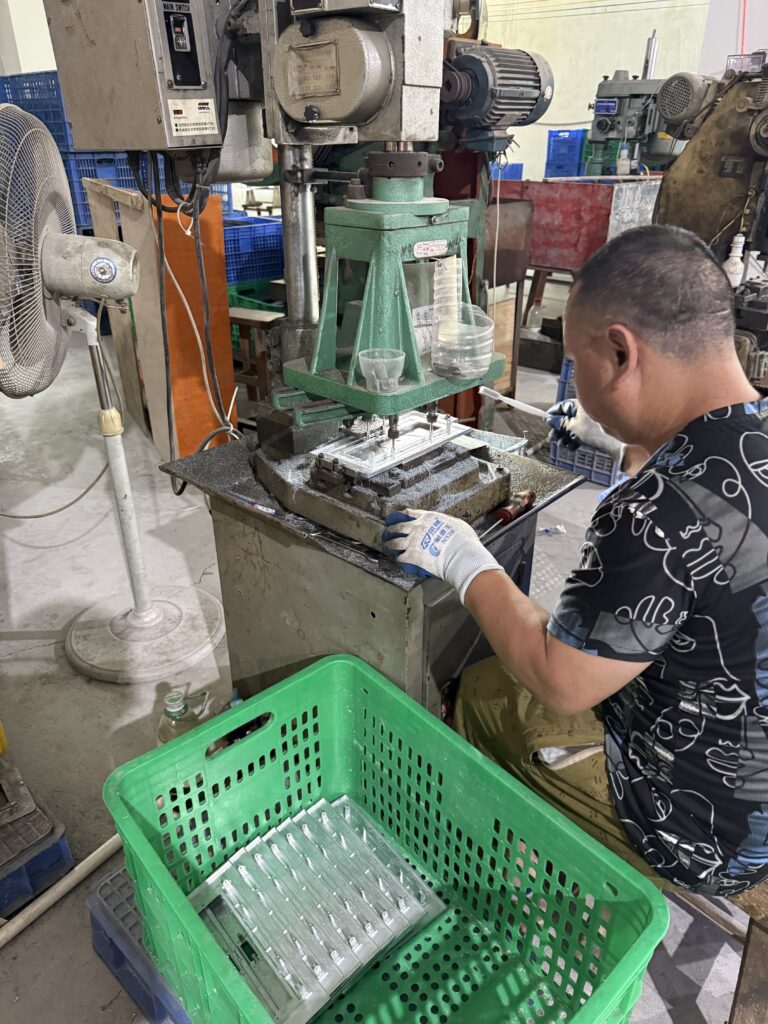 Moonian production line for pop-up desktop socket assembly showing quality inspection process at Guangdong factory
