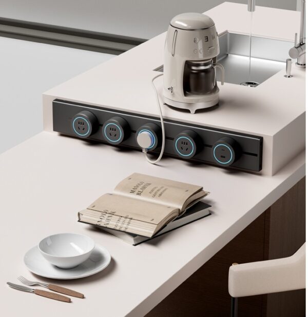 Heavy-duty industrial track socket by Moonian installed on a grey surface mounted rail Heavy-duty industrial track socket by Moonian installed on a grey surface mounted rail