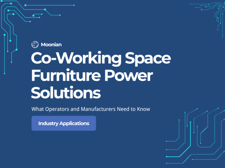 Modern co-working space with integrated pop-up sockets in hot desks providing USB-C charging and AC power for members